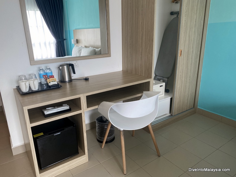 AVI Pangkor Beach Resort superior room cupboard, desk and amenities
