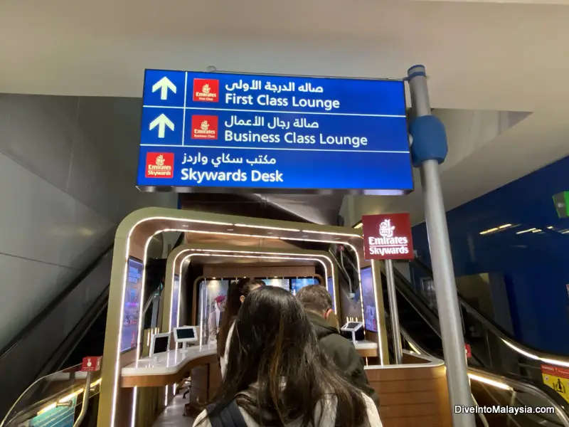 Dubai emirates lounge  Look for this sign when you enter main terminal area and head up the escalators