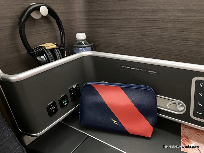Qantas business class Amenitiy kit, headphones and water bottle on boarding